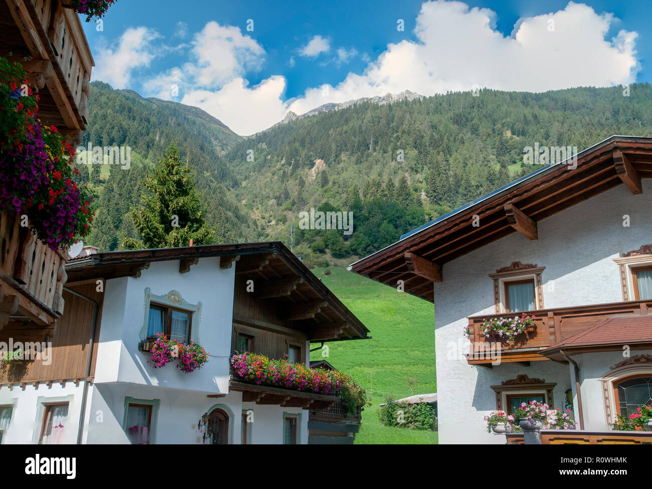 Flowering flower boxes on a balcony on a typical house in Neustift im Stubaital, Tyrol, Austria Stock Photo