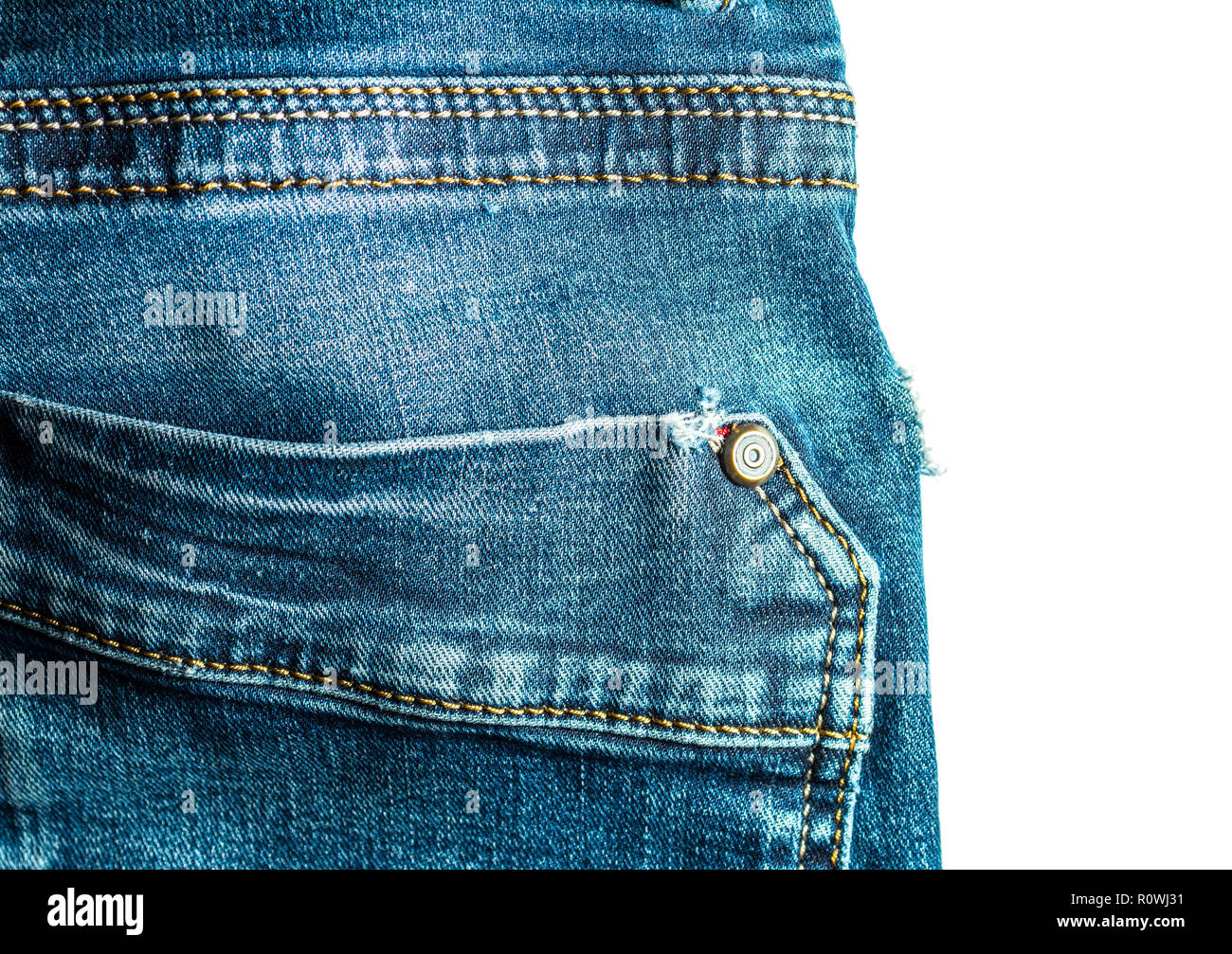 Back pocket stitching blue jeans vintage style close-up isolated on white  background Stock Photo - Alamy
