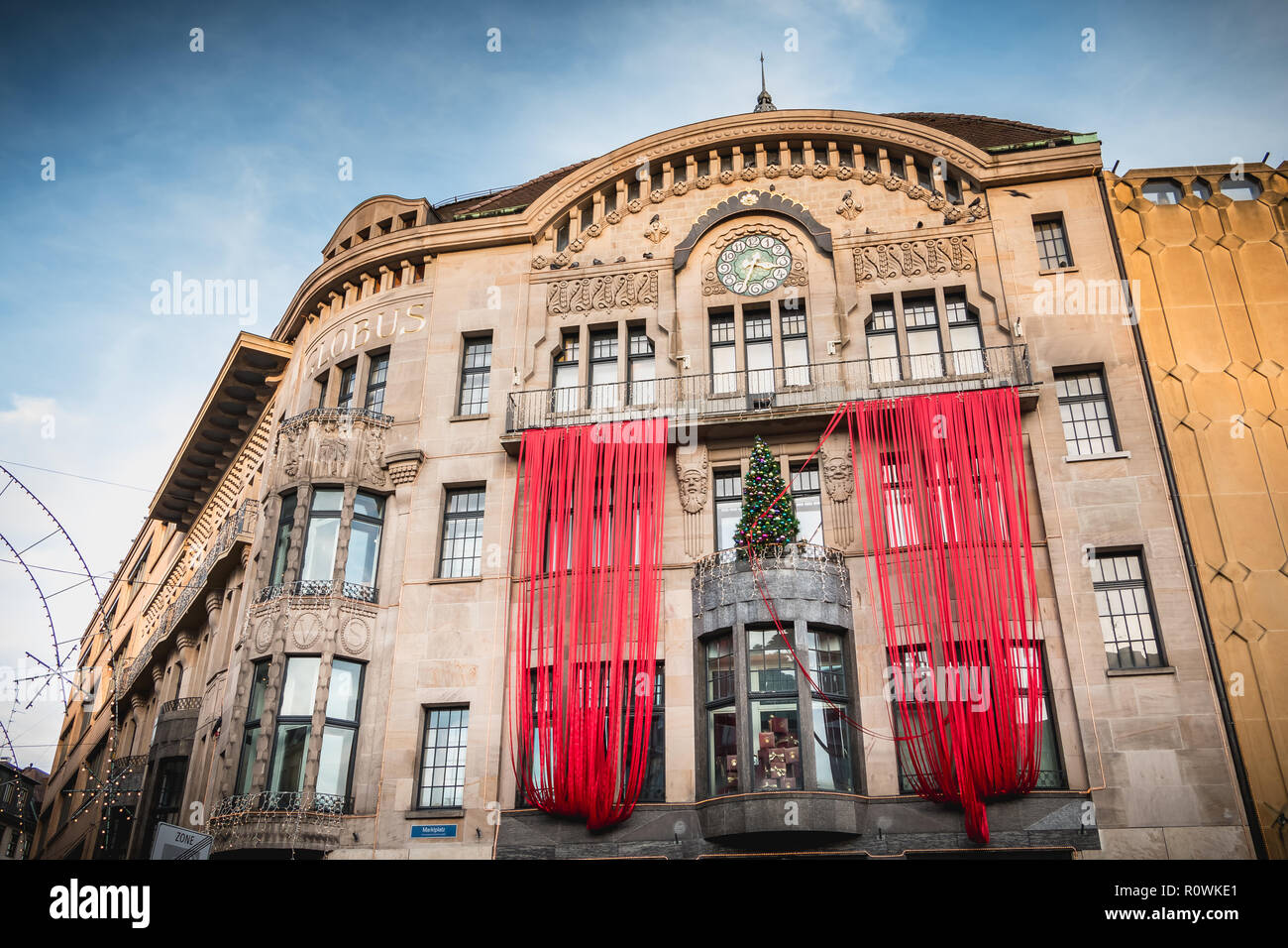 Basel, Switzerland - December 25, 2017 - Architectural detail of the Globus department store on the market square decorated for Christmas Stock Photo