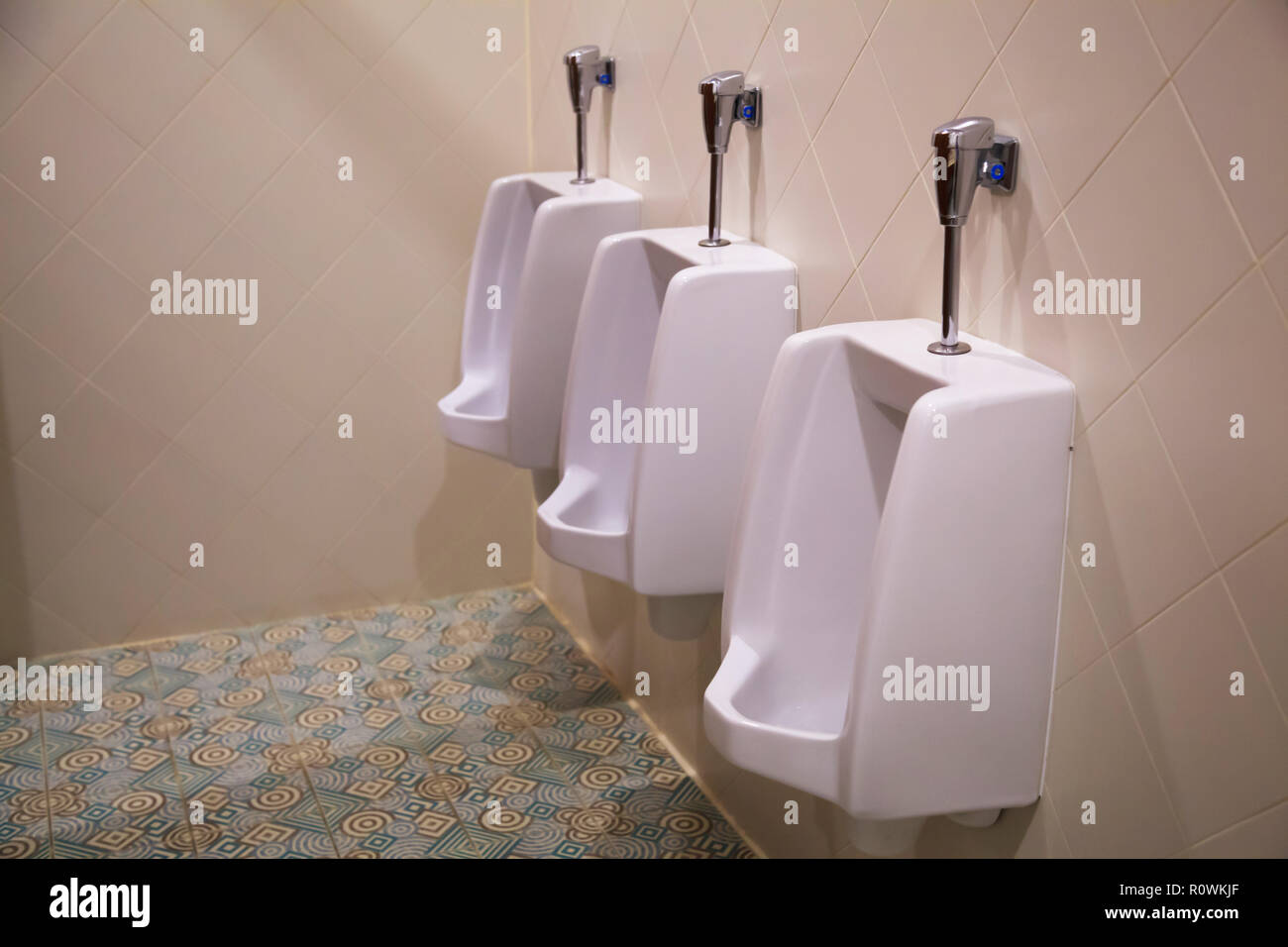 clean white male lavatory urinal sanitary ware vessel fixture or