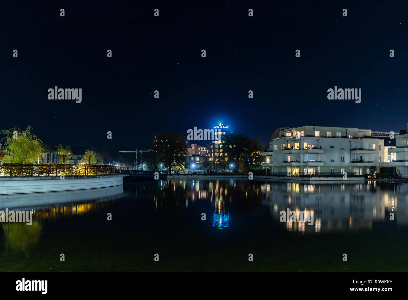 Humboldt Harbour at night with reflections on the water in  Berlin Tegel Germany Stock Photo