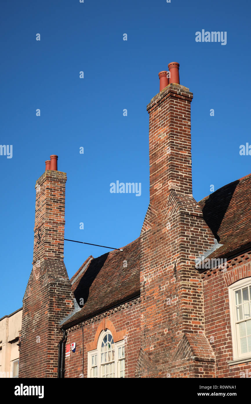 Tall chimney stacks, Old Palace, Kneesworth Street, Royston, Hertfordshire, England, UK Stock Photo