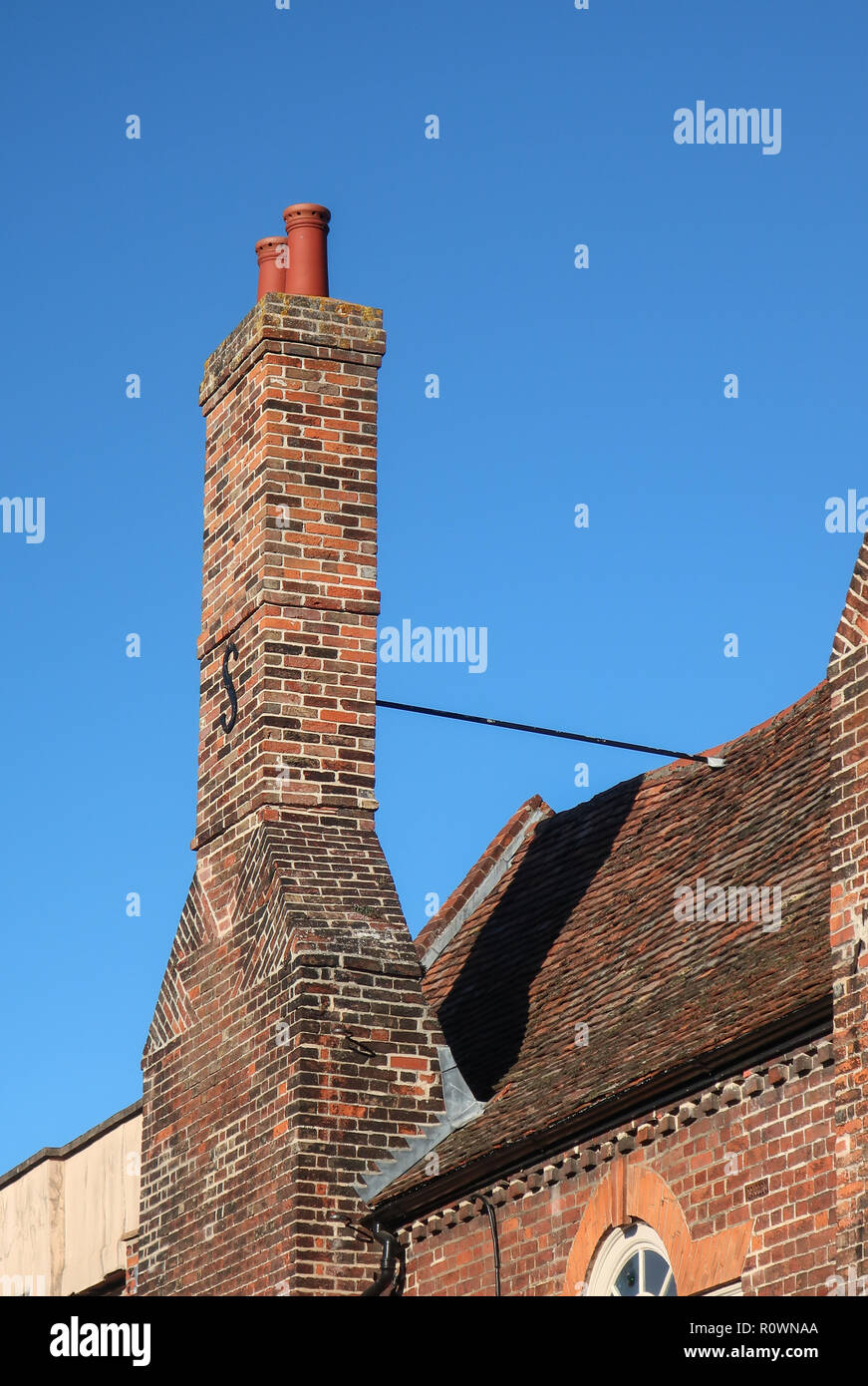 Tall chimney stack, Old Palace, Kneesworth Street, Royston, Hertfordshire, England, UK Stock Photo