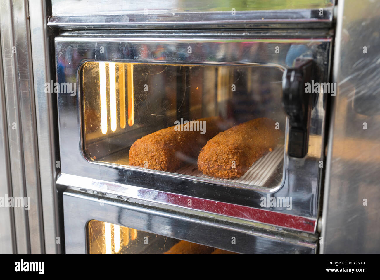Fast food delicacy croquettes inside a typical Dutch automatic machine in the Netherlands Stock Photo