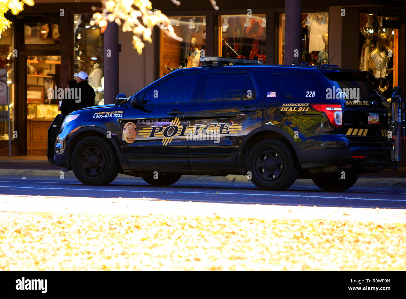 Black Police vehicle of the Santa Fe Police department cruisng the Plaza in Santa Fe NM, USA Stock Photo