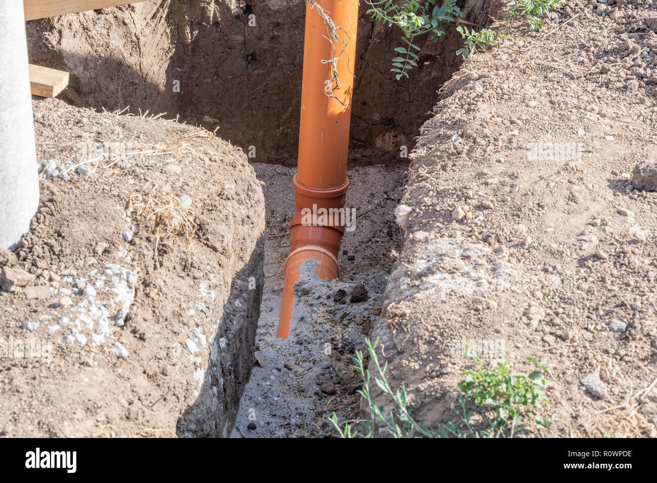 Plumbing pipe to supply water to the house. Stages of construction of
