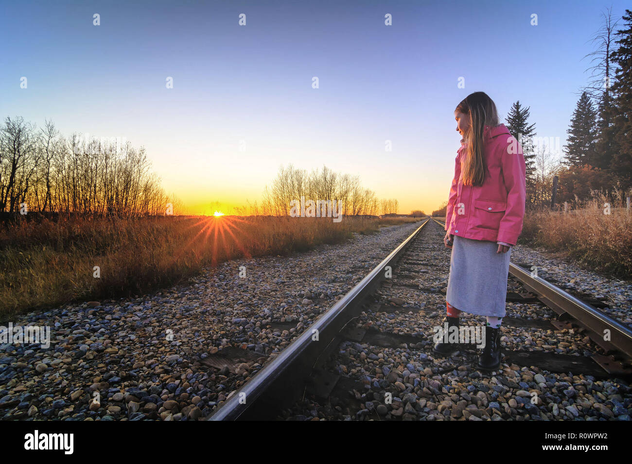 Girl Standing On Railroad Track High Resolution Stock Photography and ...