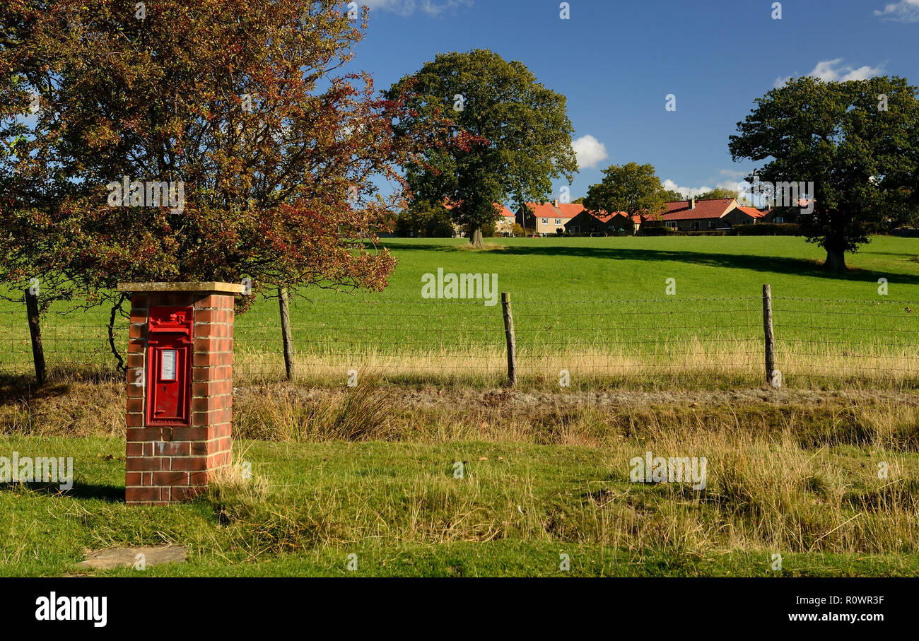 A free-standing postbox (GR) beside the village road in Goathland. Stock Photo