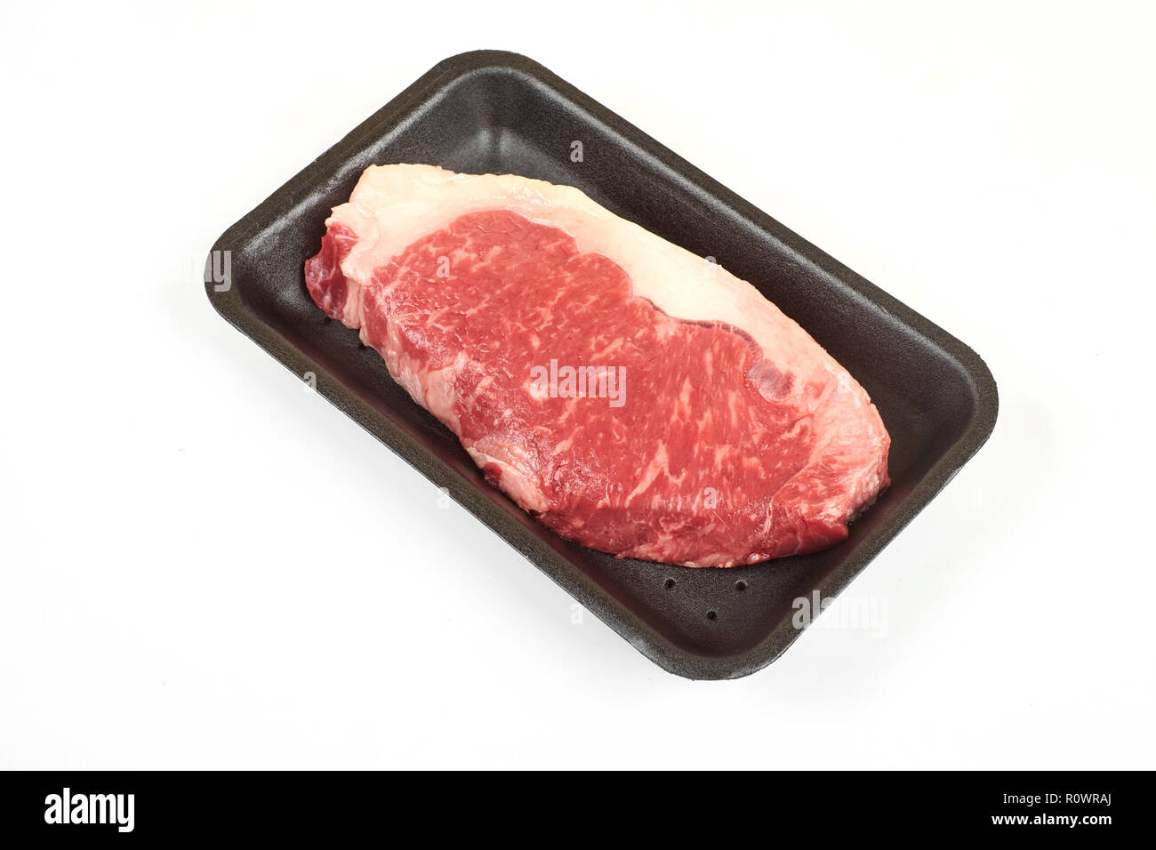 Raw sirloin beef steak in plastic packaging tray Stock Photo Alamy