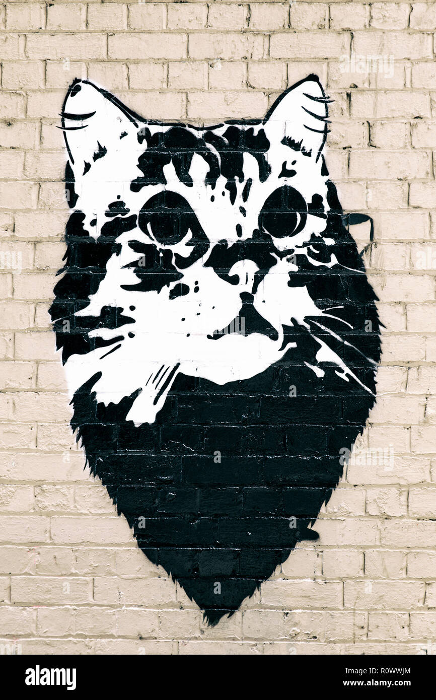 cat graffiti on brick wall, melbourne Stock Photo