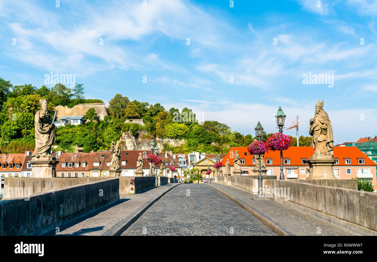 Alte Mainbrucke, the old bridge across the Main river in Wurzburg, Germany Stock Photo