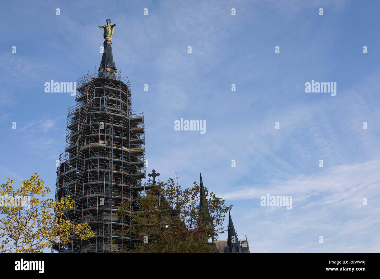 Entire church building 'Heilig Hart Kerk' in Eindhoven surrounded by scaffolding for renovation, Netherlands Stock Photo