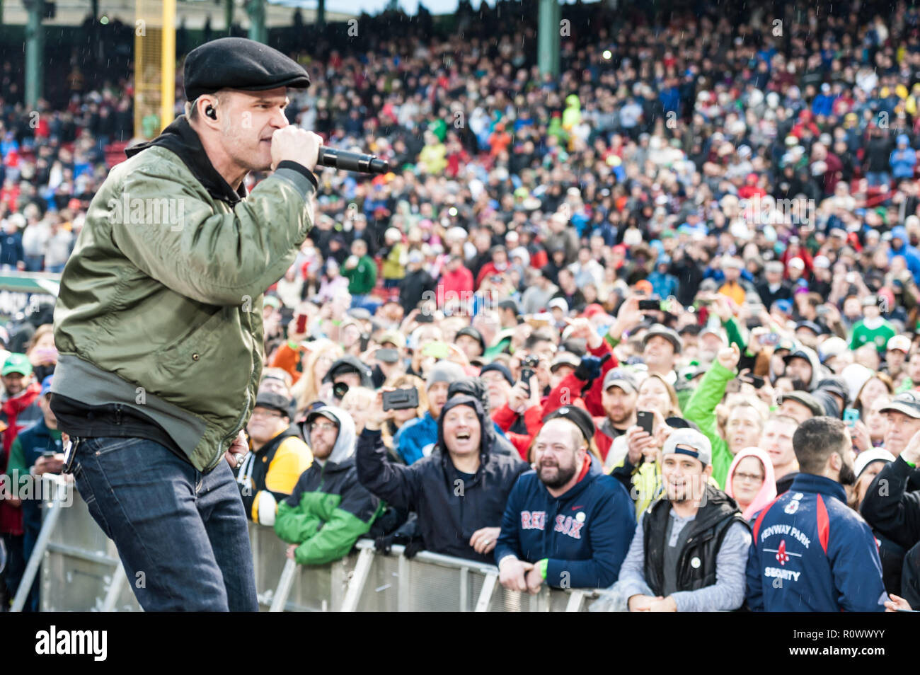 Al Barr, lead singer for the Dropkick Murphys, singing for a stadium full  of fans at Fenway Park, Boston Stock Photo - Alamy