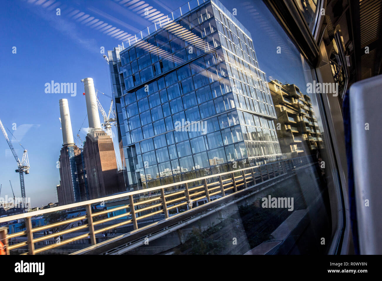 Battersea Power Station and new flats as seen from train, London, UK