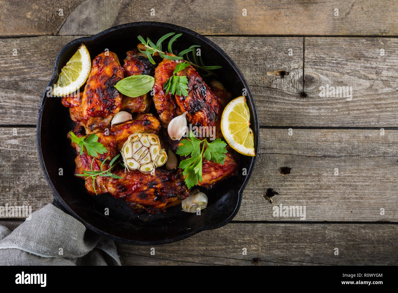 Chicken wings in cast iron skillet Stock Photo Alamy