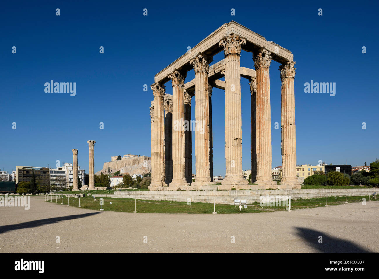 Athens. Greece. The Temple of Olympian Zeus (Olympieion) and the Acropolis in the background. Stock Photo