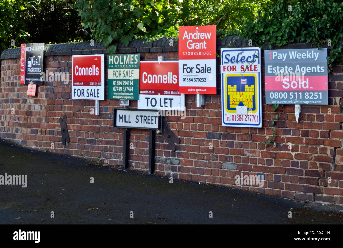 Row of To Let and For Sale Estate Agent or Real Estate  Boards, UK Stock Photo