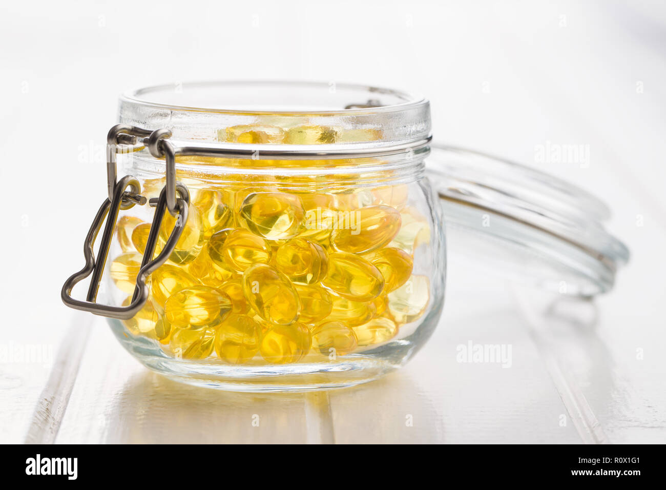 Omega 3 gel capsules in jar Stock Photo Alamy