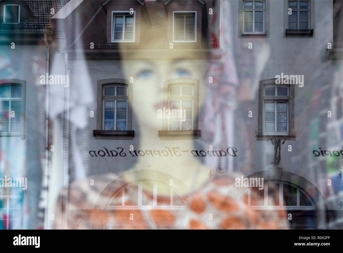 Reflection in a windowpane, women's fashion, Bad Karlshafen, Weser Uplands, Weserbergland, Hesse, Germany, Europe Stock Photo