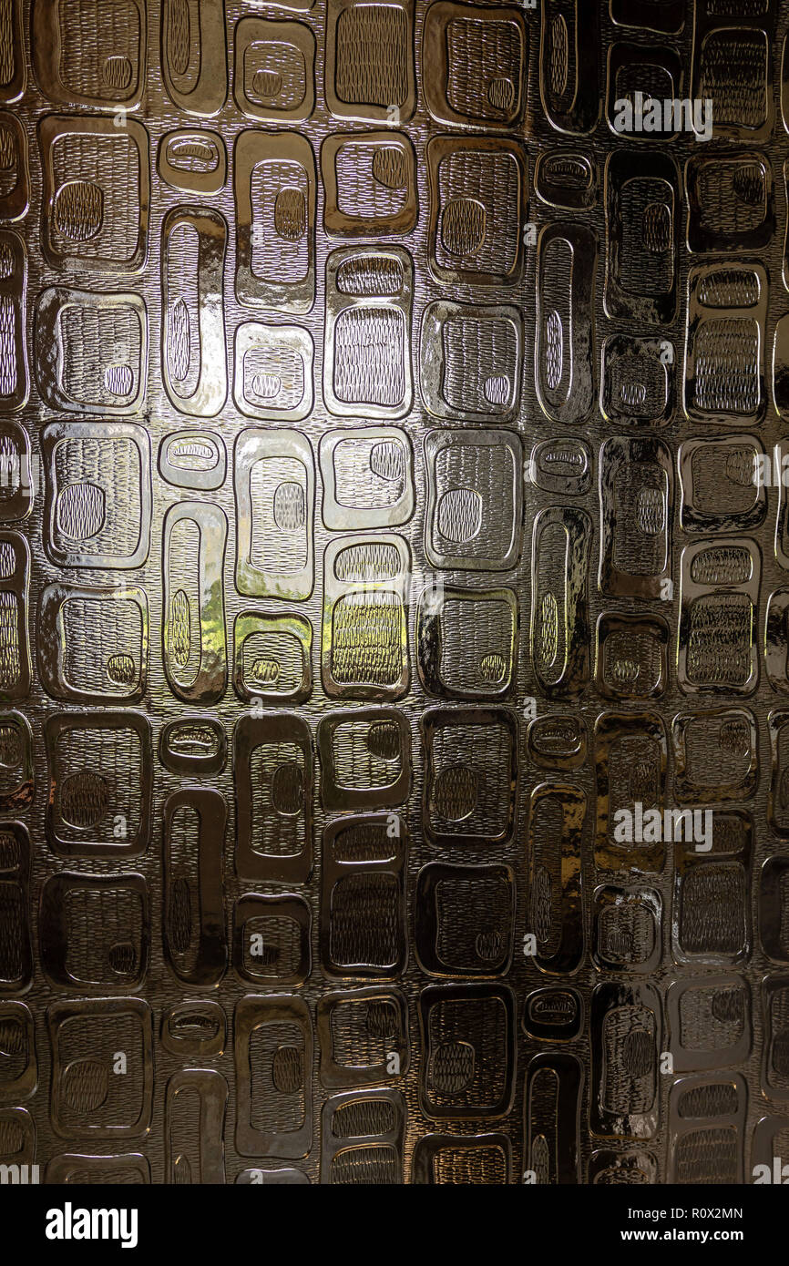 The window light is visible through the decorative door glass. Close up photography Stock Photo