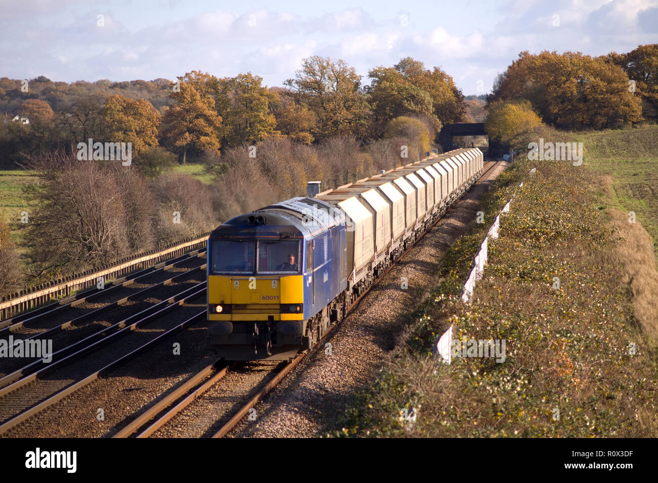 A class 60 diesel locomotive number 60011 with a train of empty stone hoppers in the up loop at Otford Junction. 11th November 2008. Stock Photo