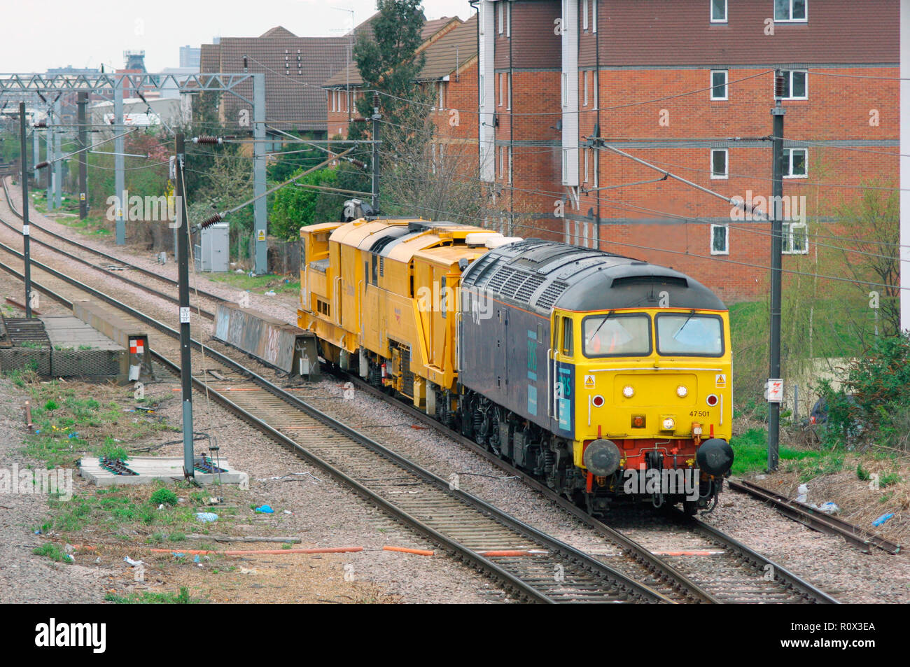 A class 47 diesel locomotive number 47501 with a stoneblower in tow at Caledonian Road and Barnsbury on the North London Line. 20th April 2006. Stock Photo