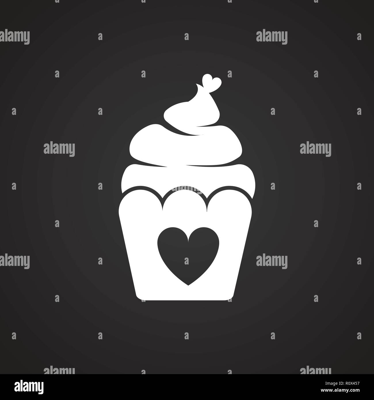 Cupcake with heart on black background Stock Vector