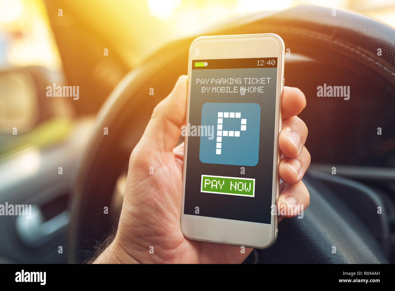 Purchase electronic ticket for car parking with mobile smart phone app Stock Photo