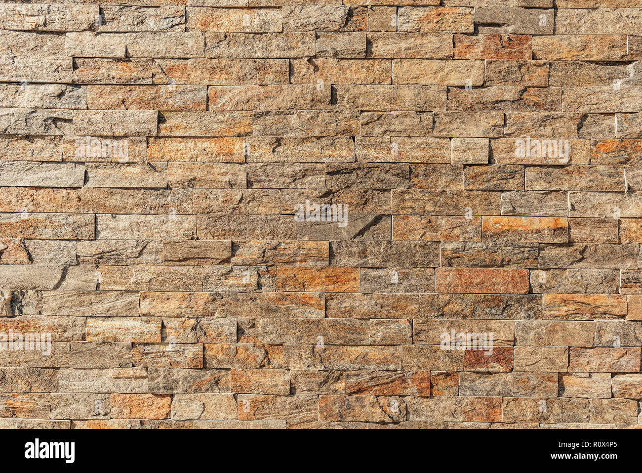 Stone accent outdoor wall surface as background Stock Photo