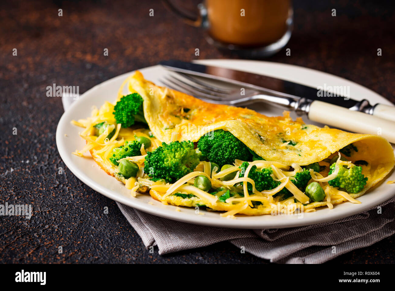Omelette with green vegetable and cheese  Stock Photo