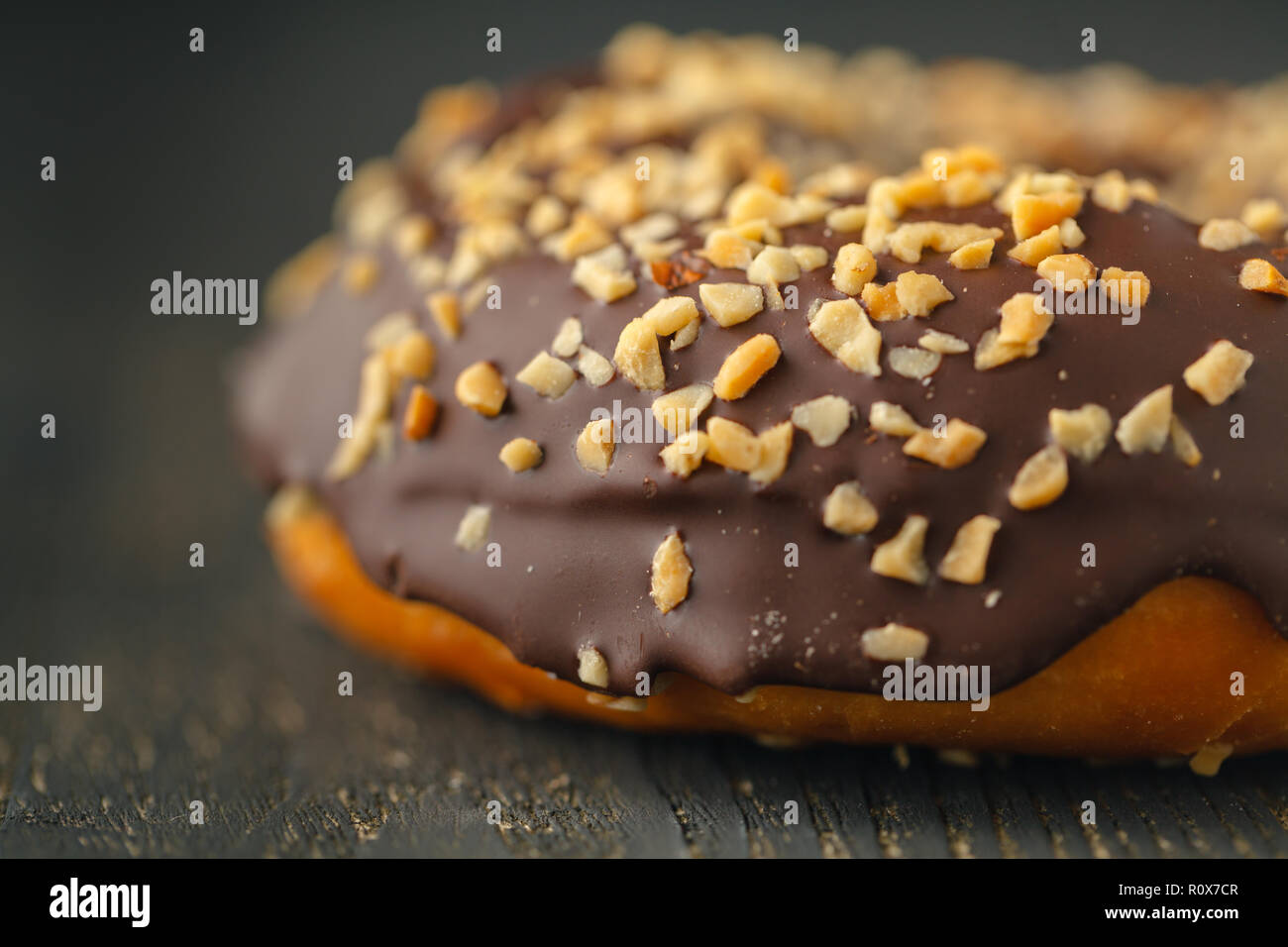 Choco donuts on wooden background. Stock Photo