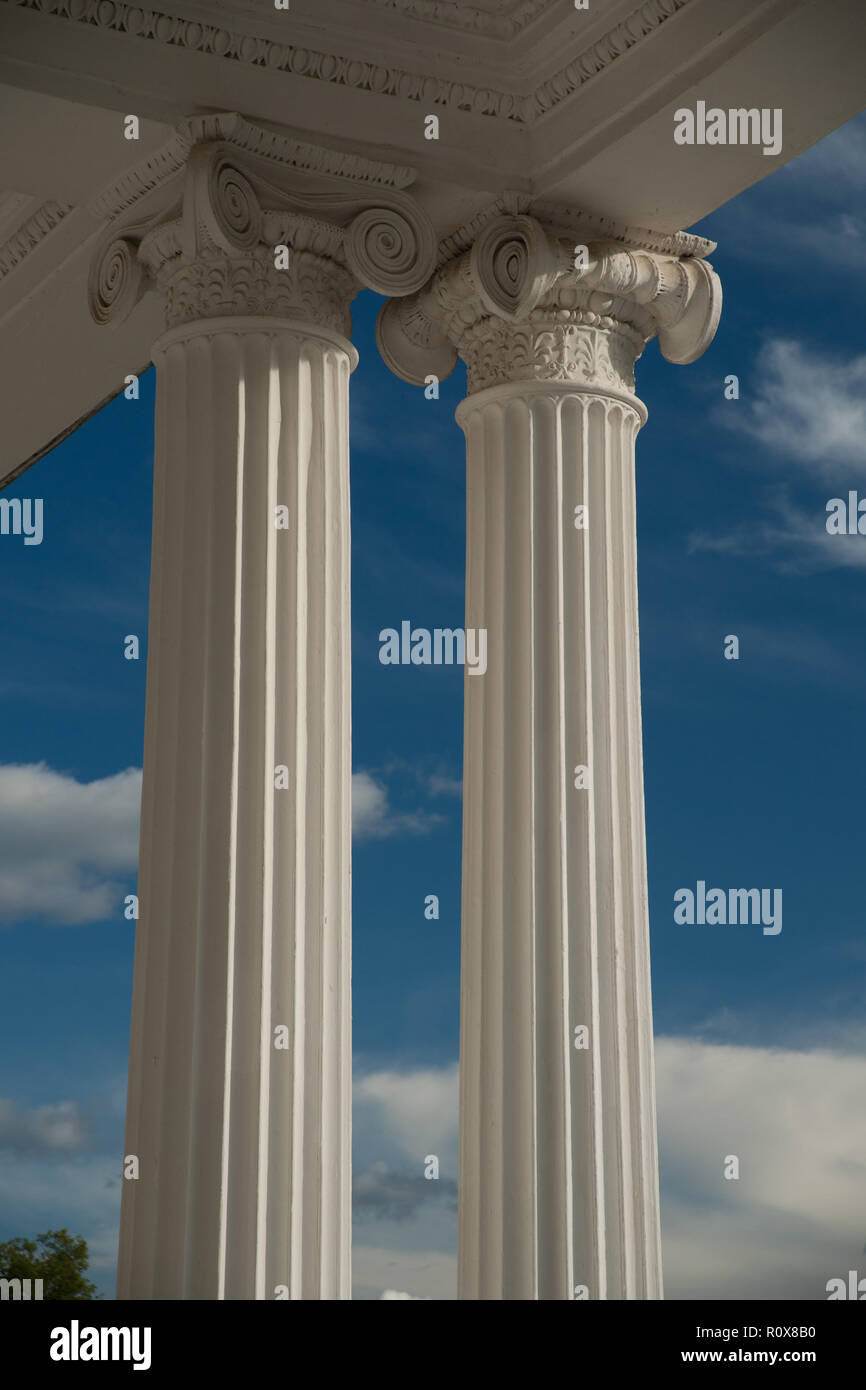 Columns on blue sky background Stock Photo - Alamy