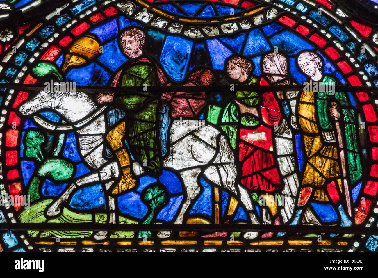England, Kent, Canterbury, Canterbury Cathedral, Stained Glass Window depicting Pilgrims on the Way to Canterbury Cathedral Stock Photo