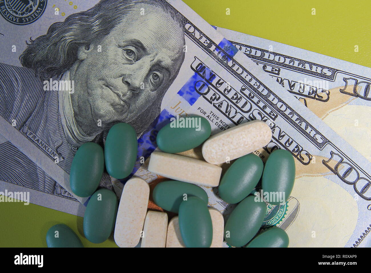 Tablets are scattered for dollars. Drug money concept Stock Photo