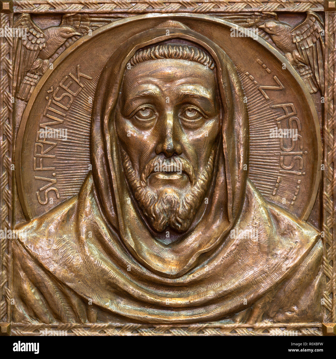 PRAGUE, CZECH REPUBLIC - OCTOBER 13, 2018: The bronze relief of St. Francis of Assisi  in church kostel Svateho Vaclava by Emanuel Kodet (1914). Stock Photo