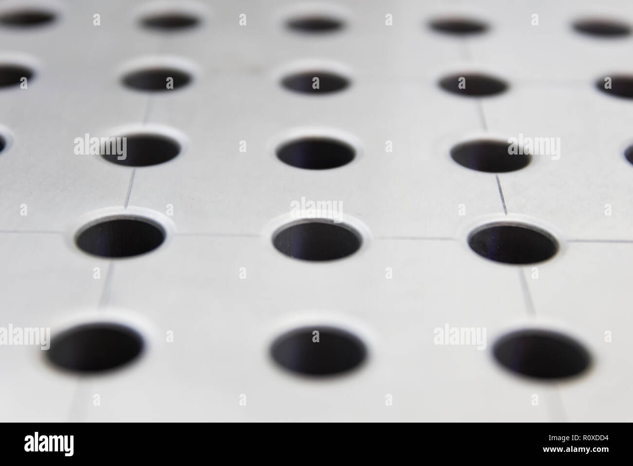 Detail of the sheet metal holes backdrop Stock Photo Alamy