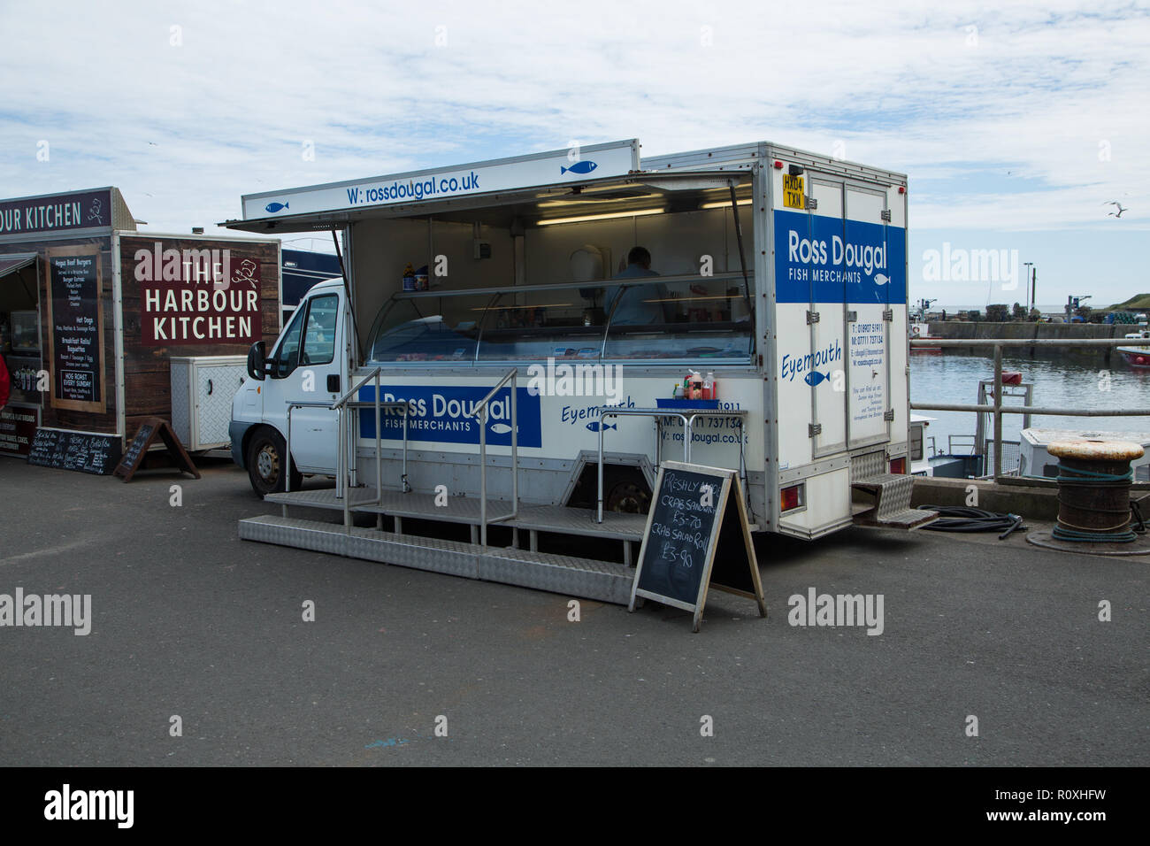 Ross Dougal Fish Merchants at Seahouses Harbour at Seahouses Village, Northumberland, UK Stock Photo