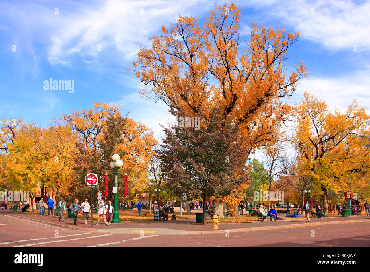 People enjoying the Fall colors and temps in the Santa Fe Plaza in