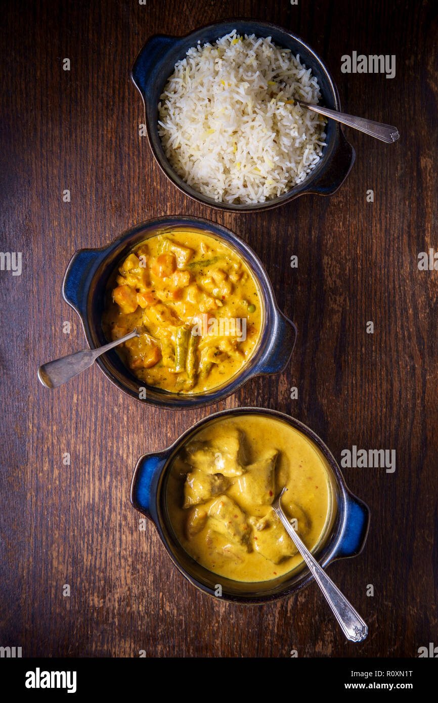 Creamy Indian food Lamb Rogan Josh and Vegetable Korma with white