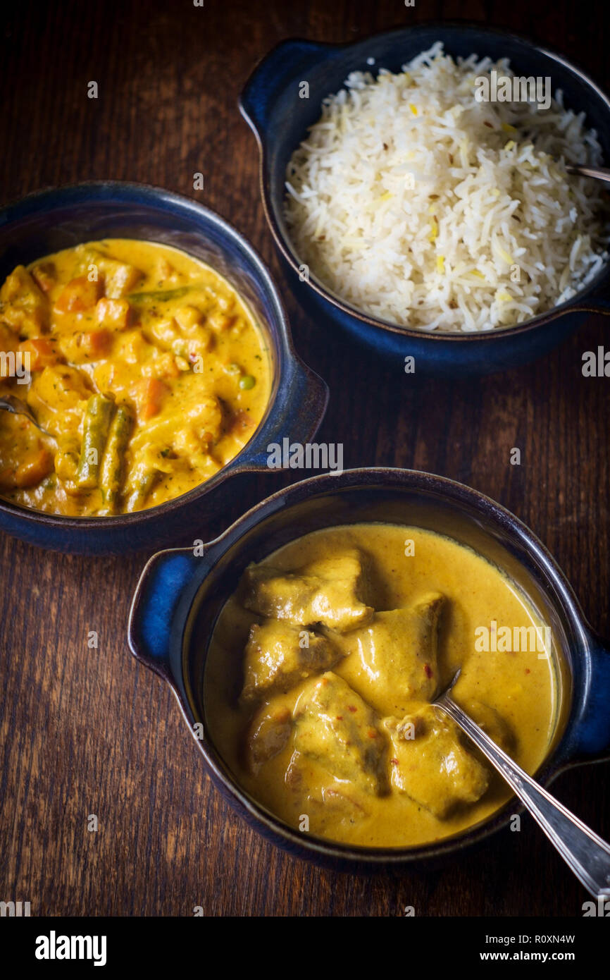 Creamy Indian food Lamb Rogan Josh and Vegetable Korma with white