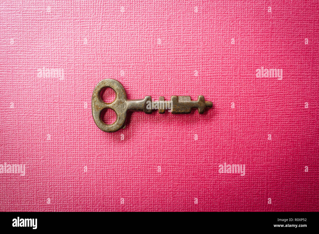 Old antique skeleton key on vivid colored background Stock Photo - Alamy
