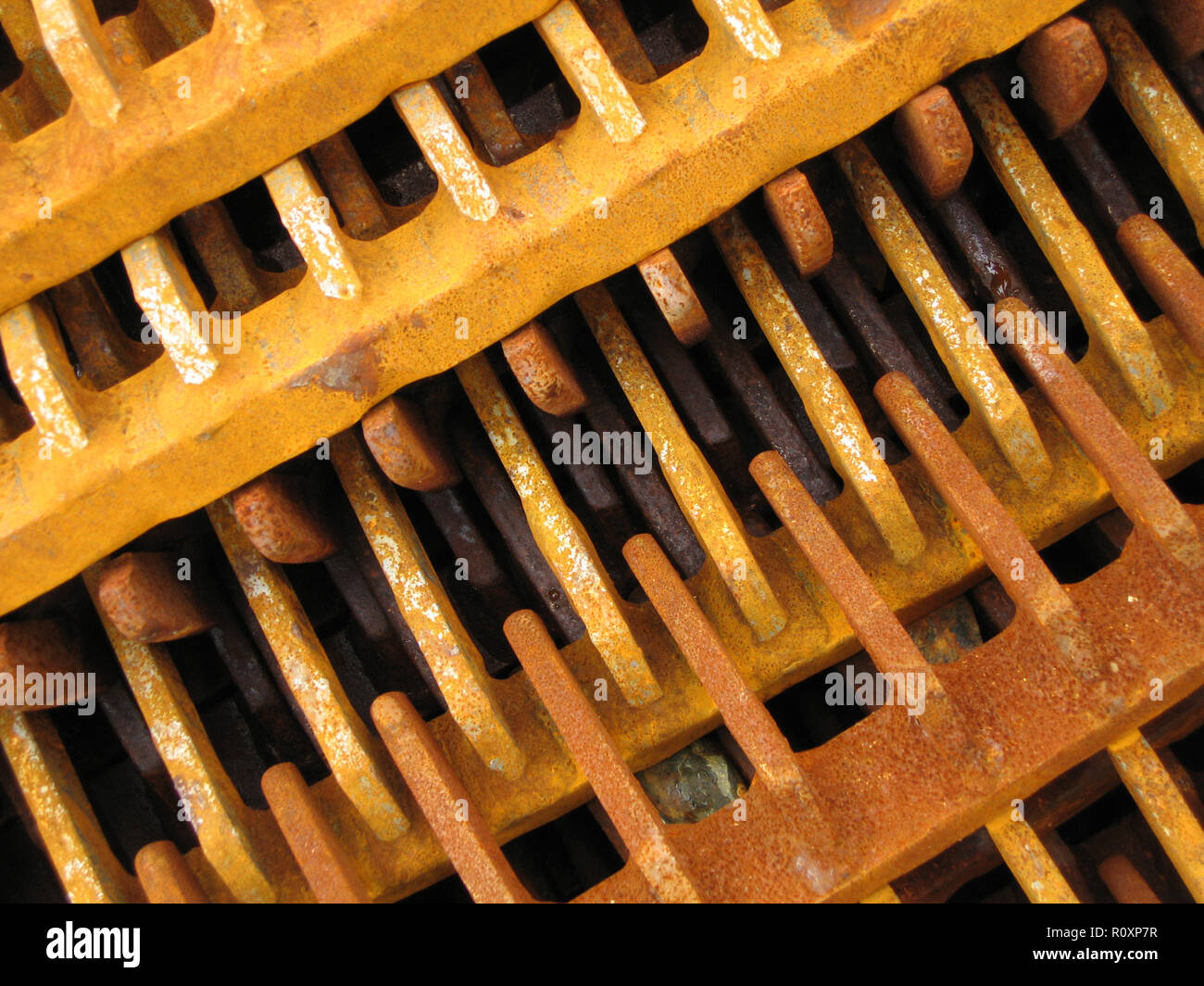 The rusty teeth on the scallop gear dredge of fishing boat in Kirkcudbright harbour, Dumfries and Galloway, Scotland Stock Photo