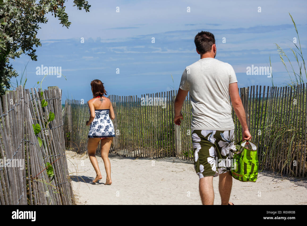 Miami Beach Florida,public beach beaches,sand,pathway,fence,protected