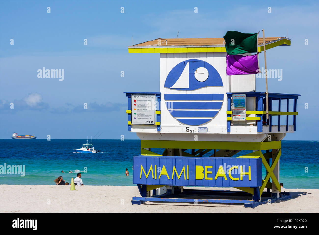 Miami Beach Florida,Atlantic Ocean,water,public beach,lifeguard stand,station,shore,safety,warning flag,purple,green,dangerous marine life,FL090607142 Stock Photo