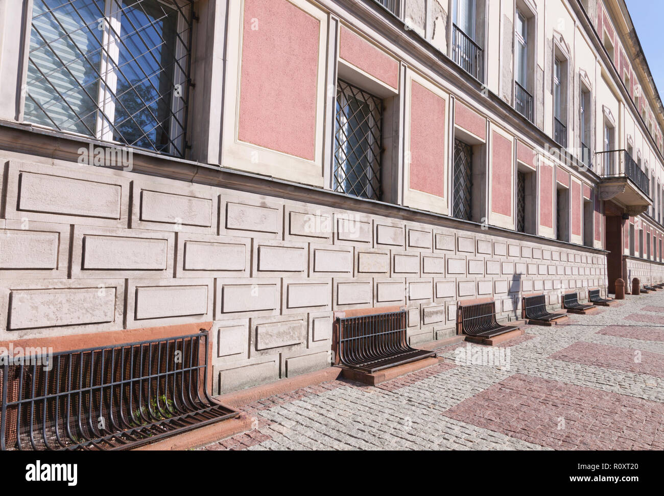 Side of a town building with bars in windows , balcony on Warsaw street . Stock Photo