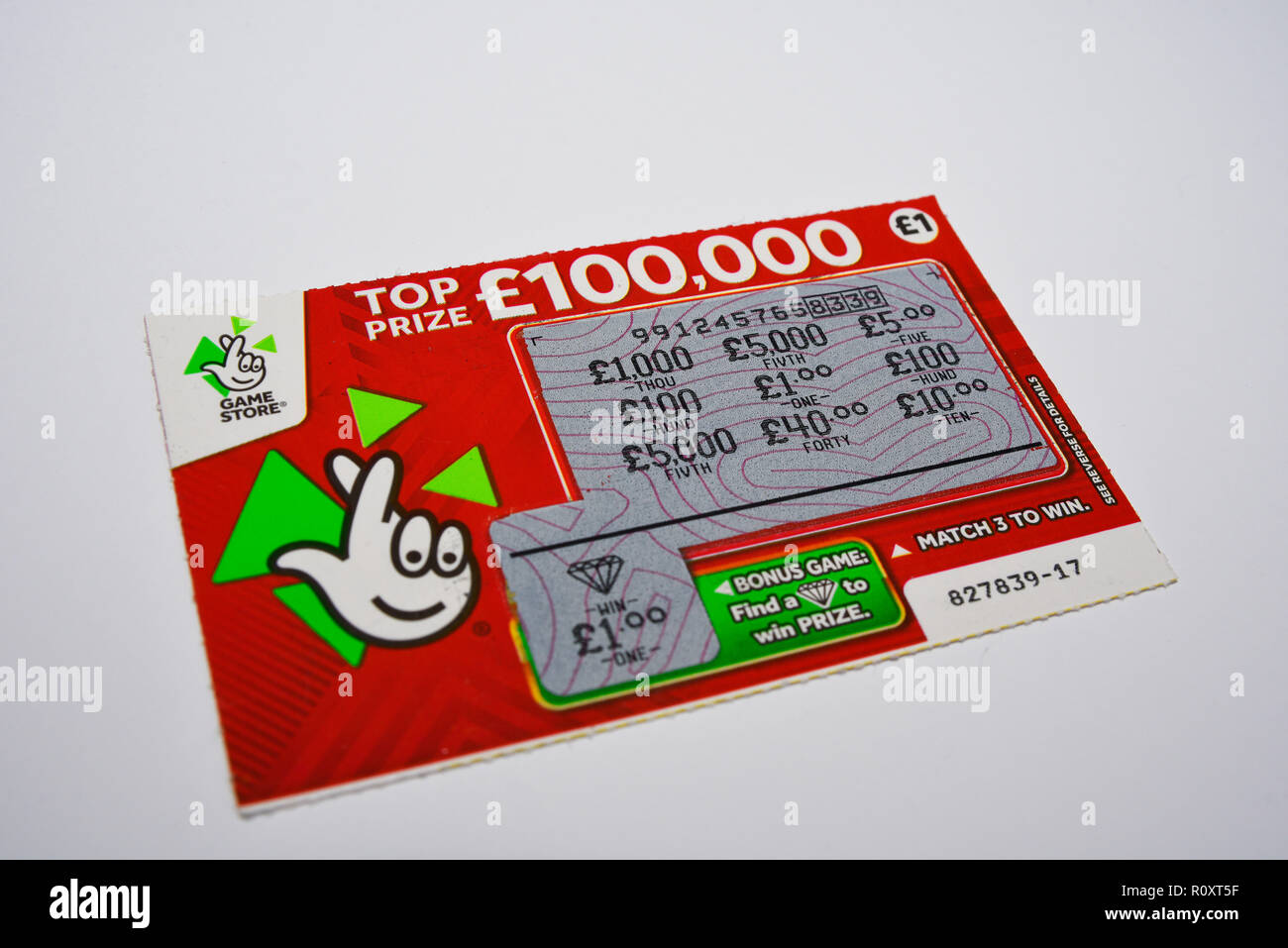 Winning scratchcard national lottery ticket. £1 win. Winning scratch card. Bonus game win. Game store. £1 play. Isolated on a white background Stock Photo