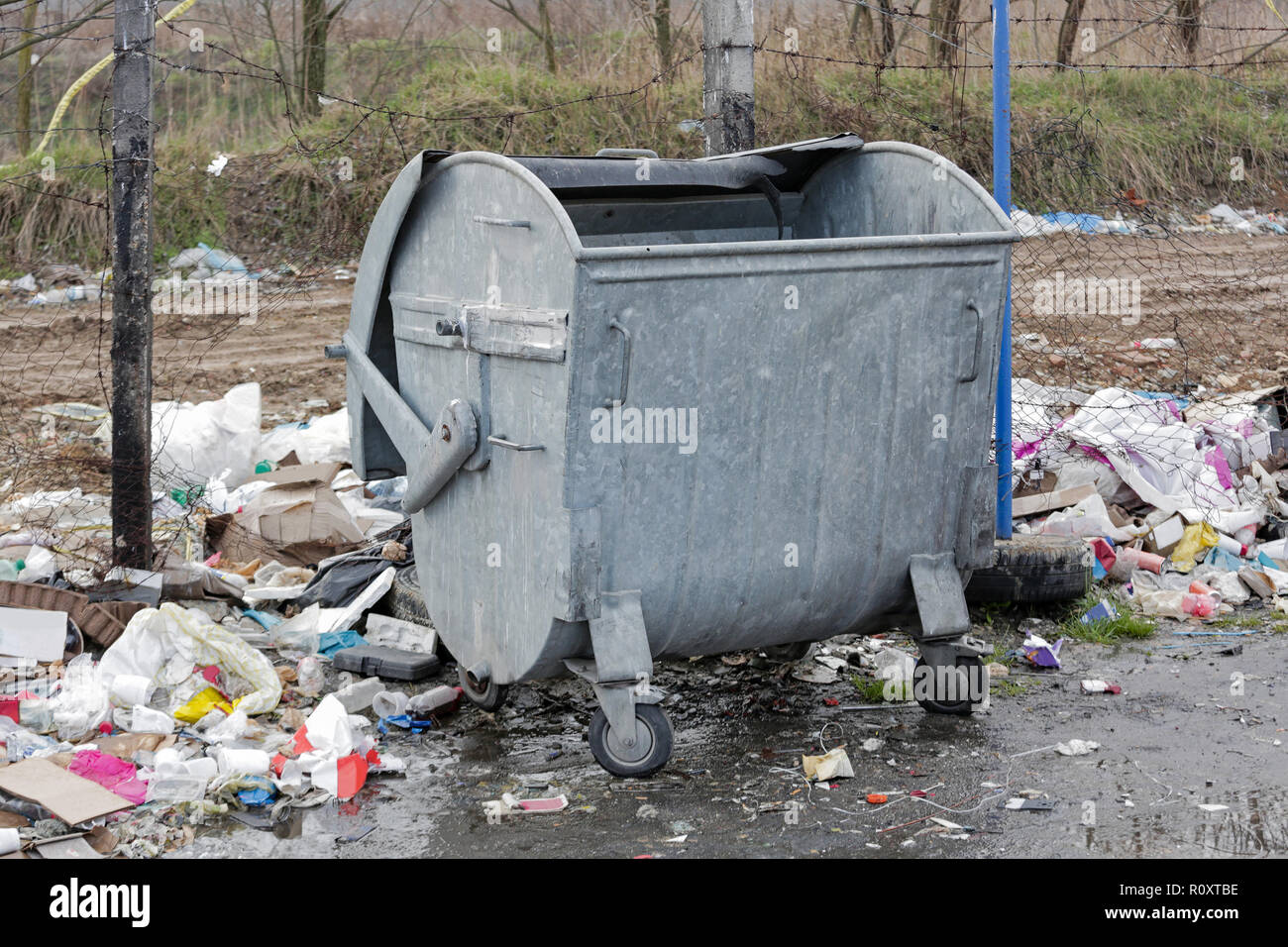 Garbage Litter and Empty Trash Bin Stock Photo Alamy