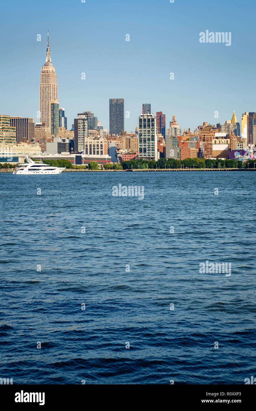 Beautiful New York City skyline against summer blue sky Stock Photo - Alamy