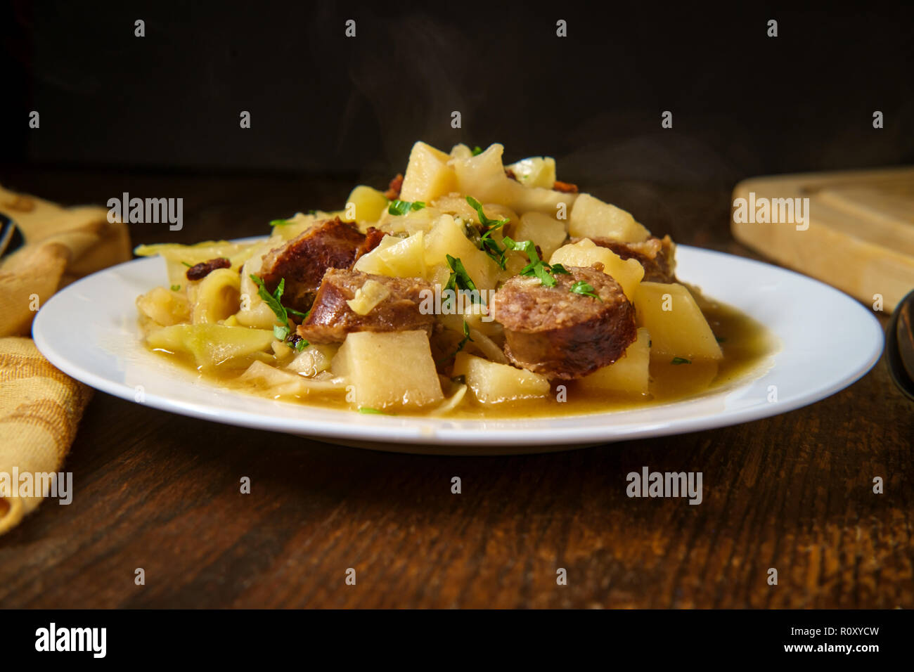 Hearty German Oktoberfest stew with beer bratwurst shredded cabbage and
