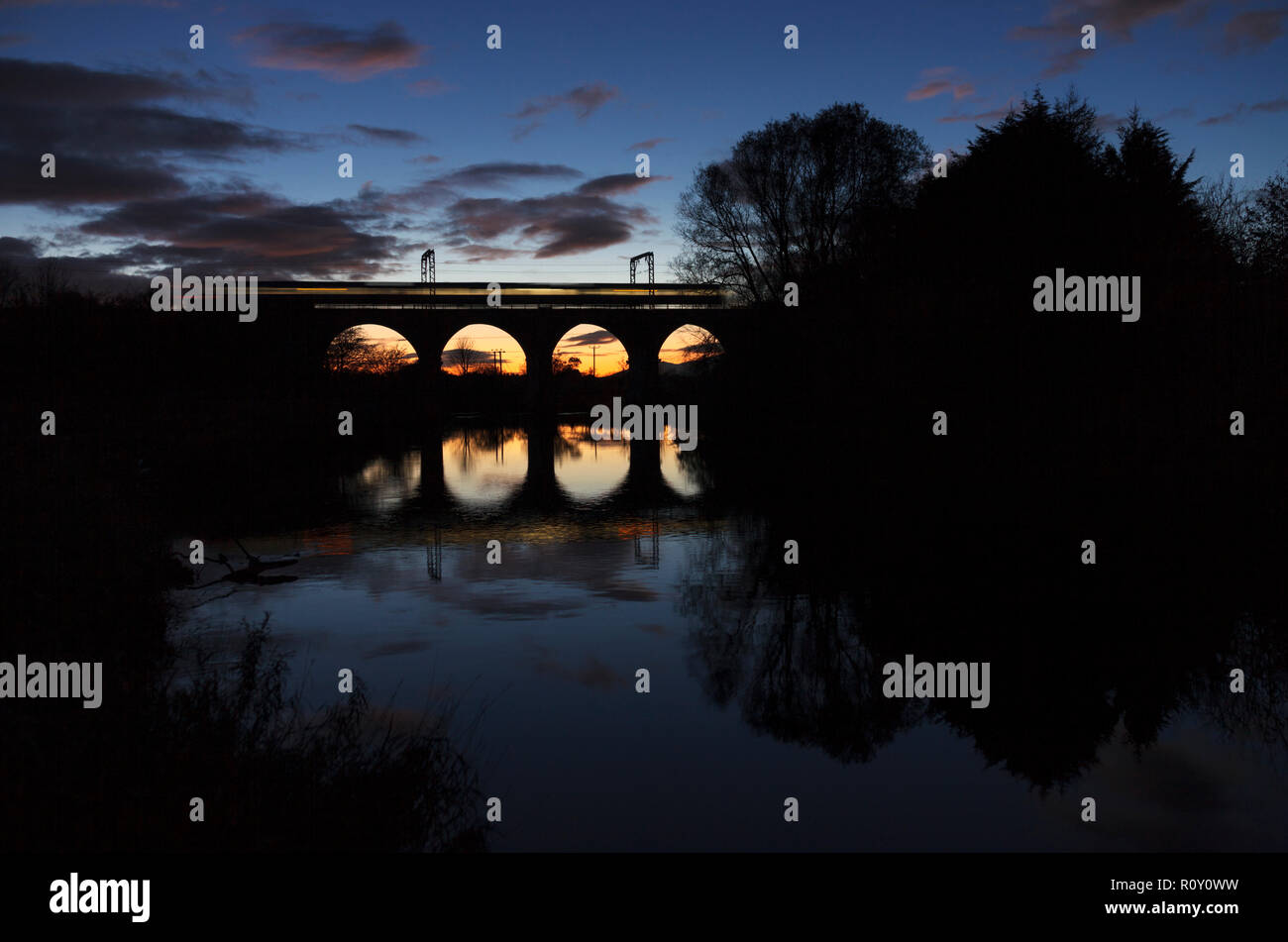 A Scotrail class 380 electric train crossing Garnock Longford viaduct